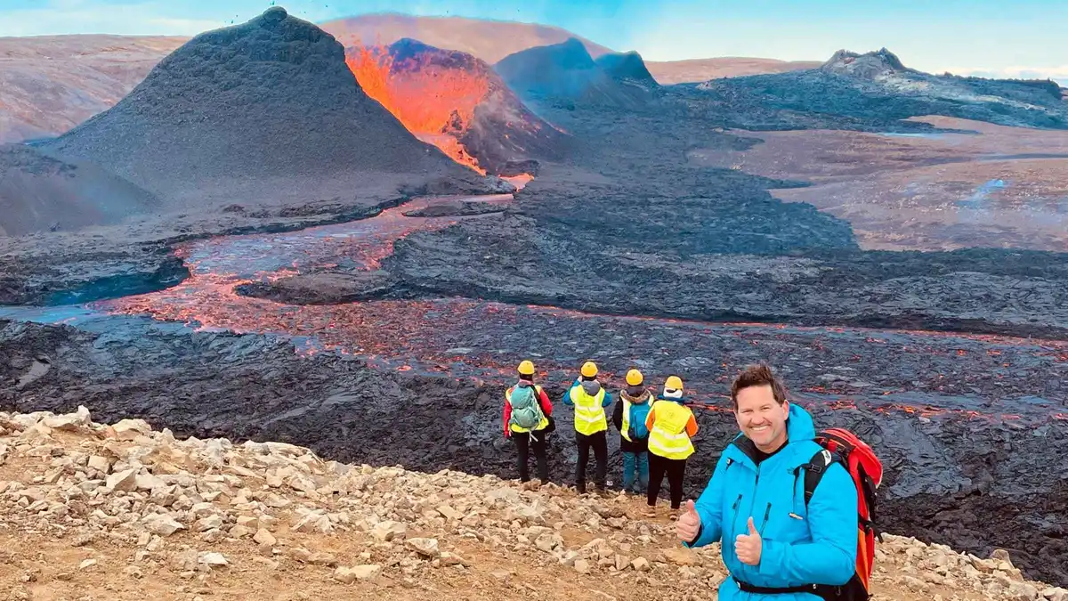 Hikers crossing black ropey lava on a small-group Fagradalsfjall volcano tour with a local Grindavik guide, Reykjanes Peninsula, Iceland